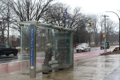 People wait for the bus in Pelham Parkway on Friday, Feb. 2, 2024.