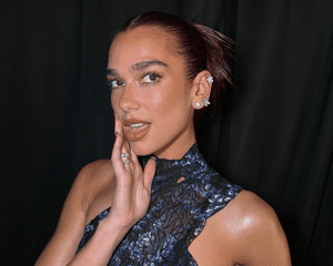 Dua Lipa with multiple ear piercings at the ACM Awards