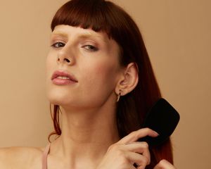 woman brushing hair