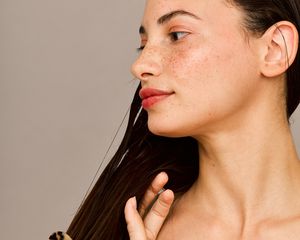 woman combing wet hair