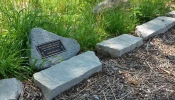 A grave marker in the Meadows of St. Kateri, the natural burial section at St. Michael the Archangel Cemetery in the Archdiocese of Chicago