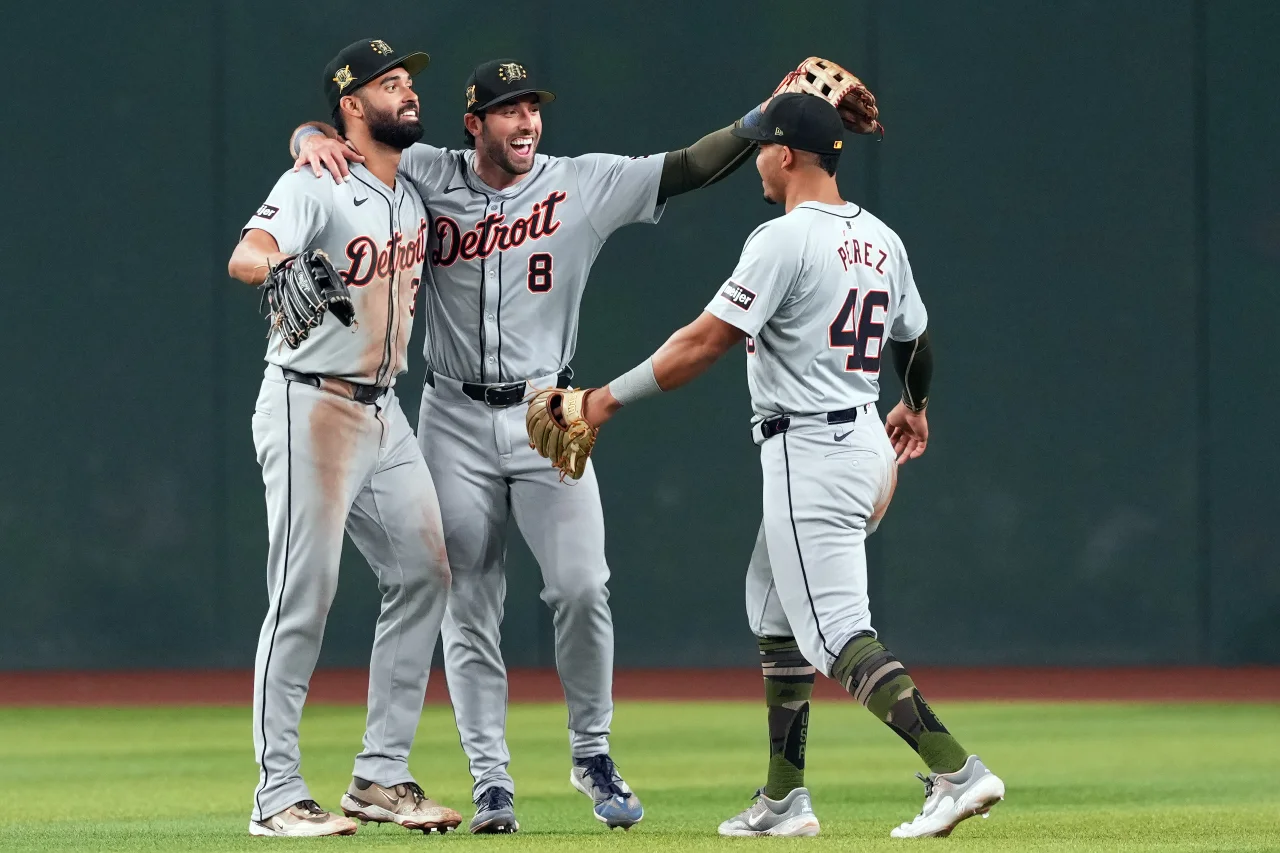 Detroit Tigers outfielder Riley Greene (31) and Detroit Tigers third base Matt Vierling (8) and Detroit Tigers outfielder Wenceel Pérez (46) celebrate after defeating the Arizona Diamondbacks at Chase Field.