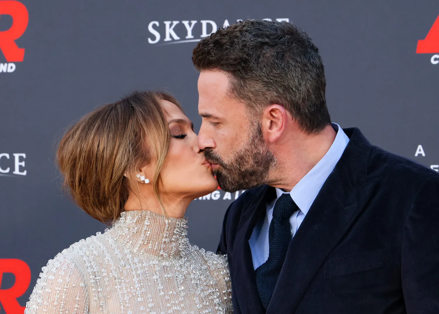 Jennifer Lopez and Ben Affleck kissing at a movie premiere in 2023