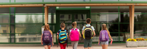 Grade School students walking into their energy optimized and sustainable educational facility.