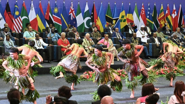 King Charles III, centre, watches as dancers perform during the opening ceremony for the Commonwealth Heads of Government Meeting (CHOGM) in Apia, Samoa, on Friday, Oct. 25, 2024. (AP Photo/William West, Pool)