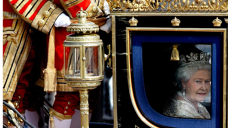 Britain's Queen Elizabeth II travels in a carriage to the Houses of Parliament in London for the State Opening of parliament, Tuesday, May 25, 2010. (AP / Kirsty Wigglesworth)