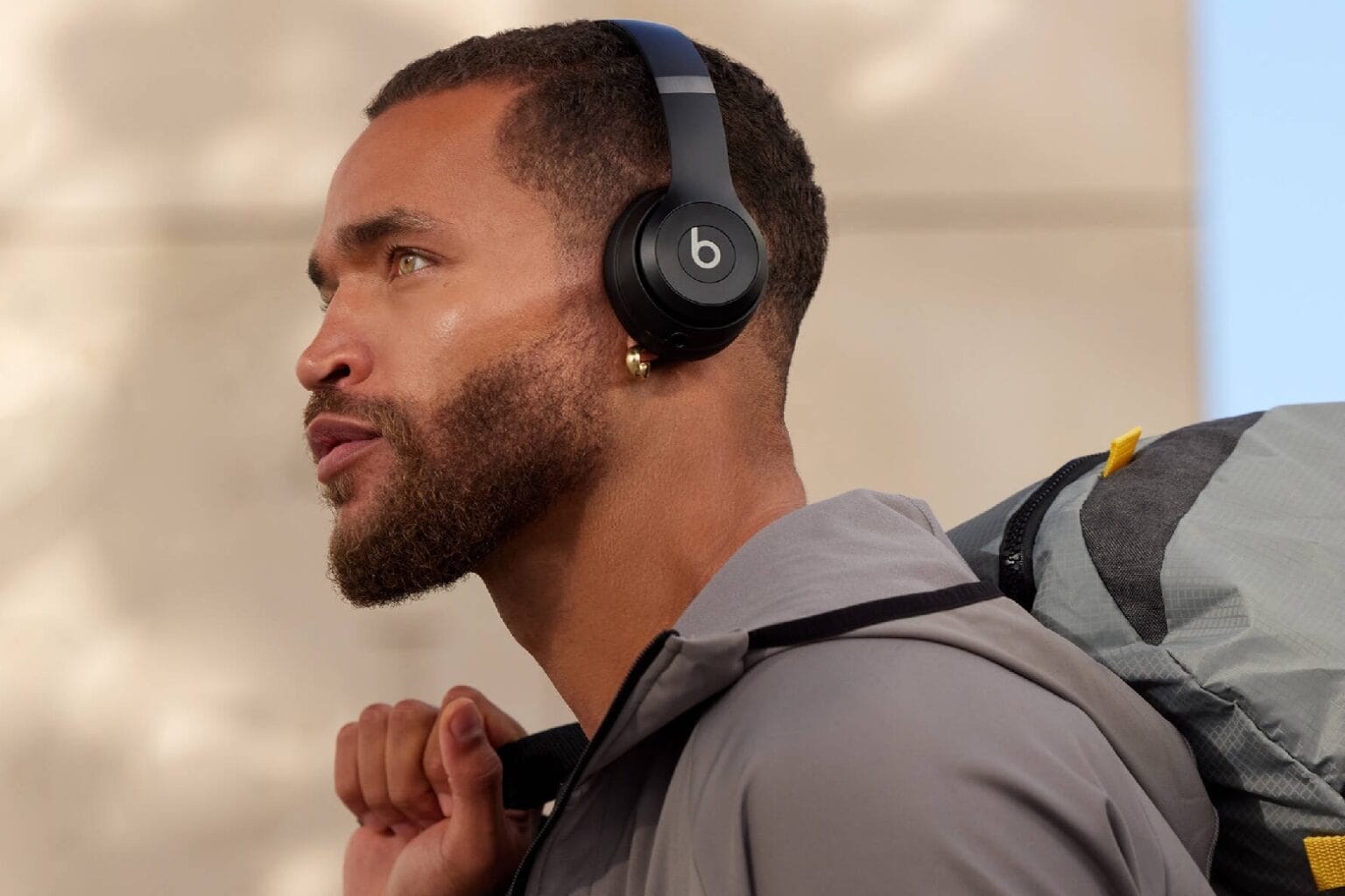 Man wearing Beats Solo 4 wireless headphones.