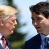 U.S. President Donald Trump stands next to Canada's Prime Minister Justin Trudeau during a conversation.