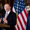 Donald Trump listens while standing to the side as Cantor Fitzgerald Chairman and CEO Howard Lutnick speaks during a news conference.