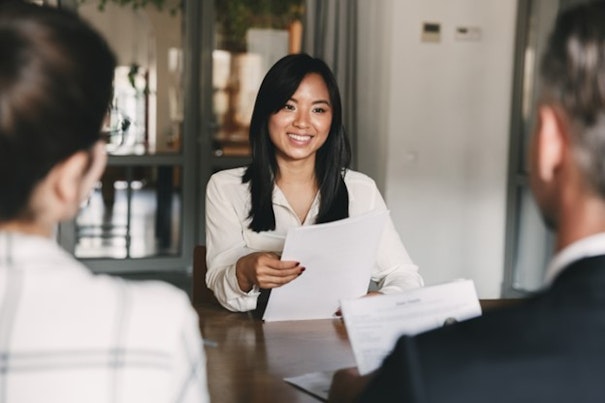 a woman having a meeting with two people