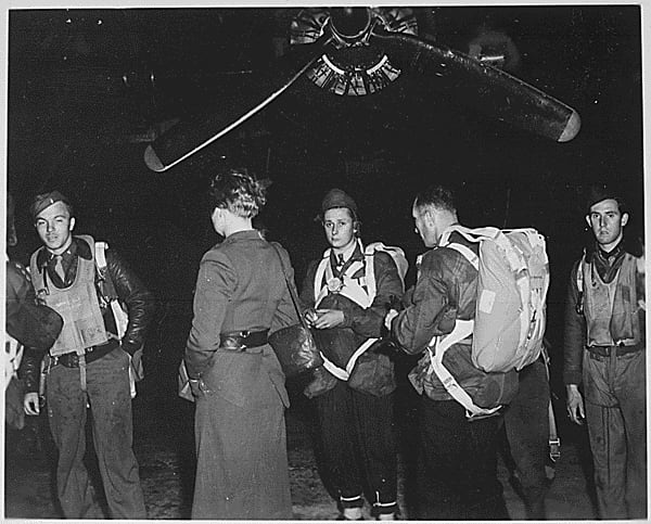 Members of the clandestine 'Jedburghs' teams in front of a B-24 just before night takeoff.