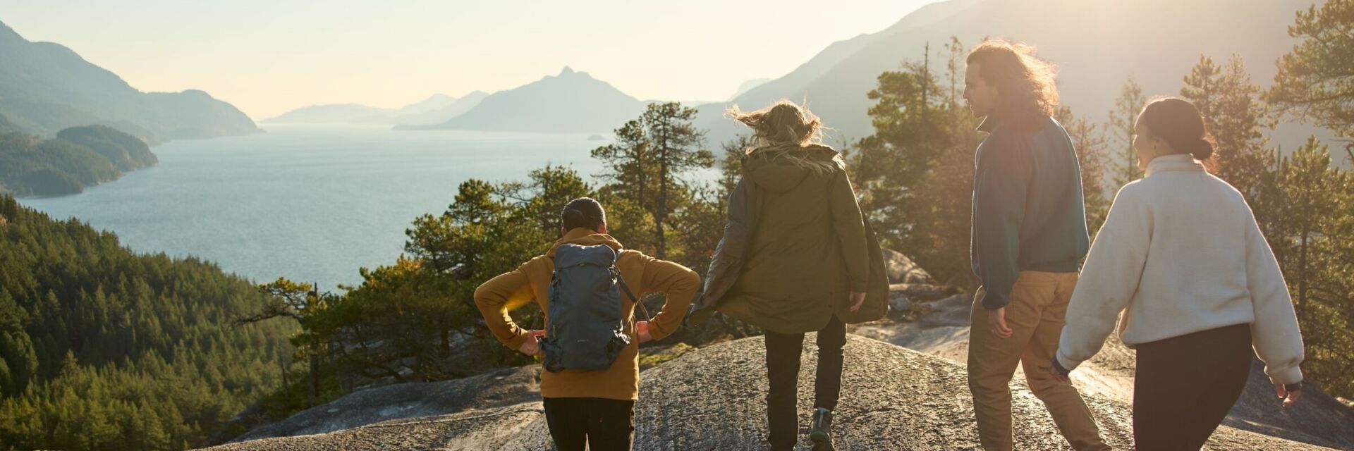 Friends enjoy views of Howe Sound and the surrounding mountains while hiking in Murrin Provincial Park south of Squamish.