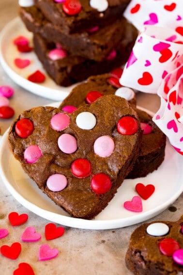 Valentine brownies on a plate, decorated with M&M's.