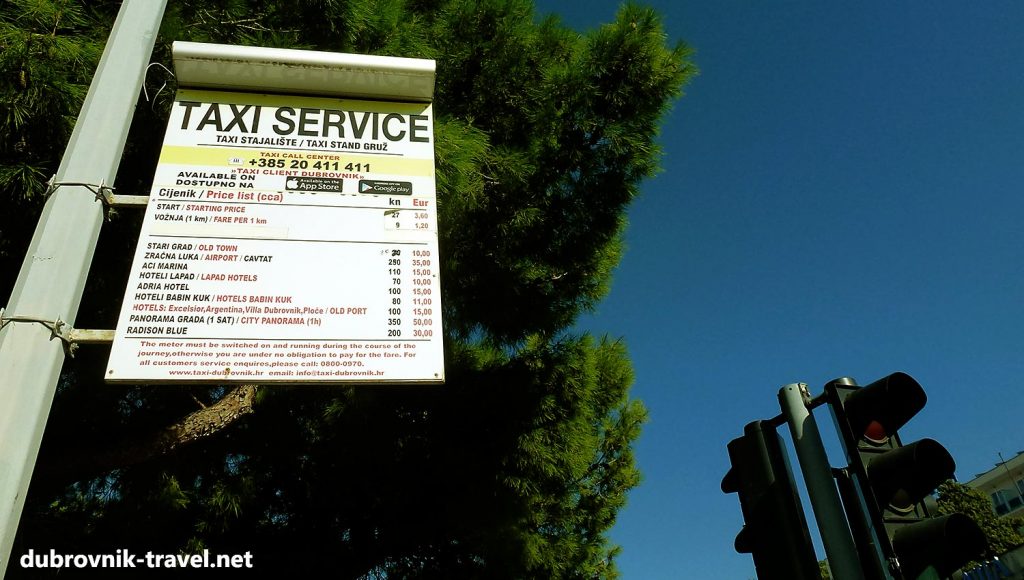 prices displayed at the taxi station near the port