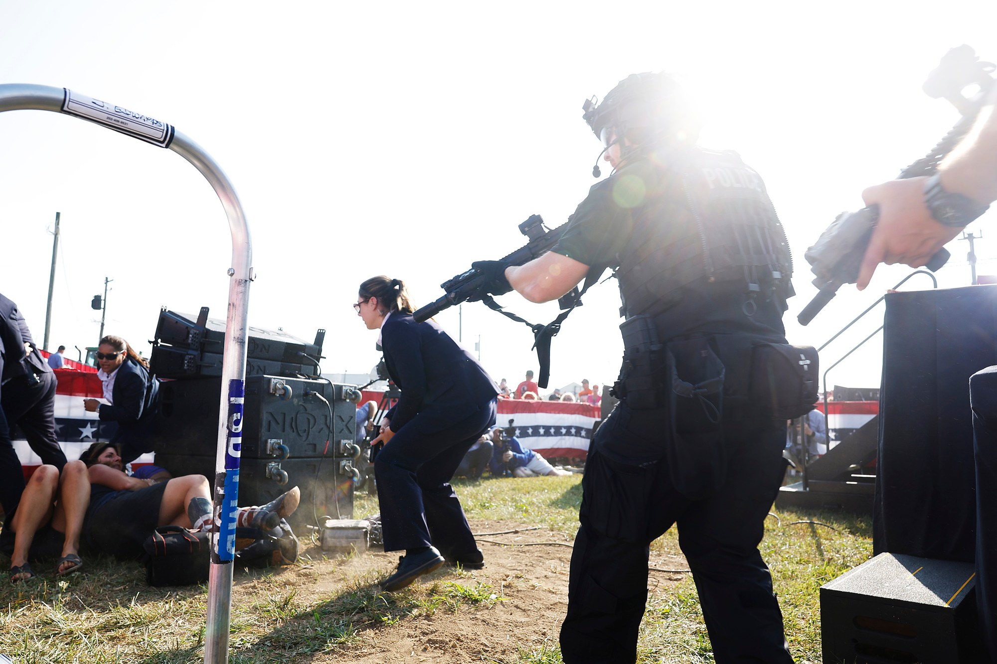 BUTLER, PENNSYLVANIA - JULY 13: Law enforcement react after shots were fire at republican presidential candidate former President Donald Trump's rally on July 13, 2024 in Butler, Pennsylvania. Butler County district attorney Richard Goldinger said the shooter is dead after injuring former U.S. President Donald Trump, killing one audience member and injuring another in the shooting. (Photo by Anna Moneymaker/Getty Images)