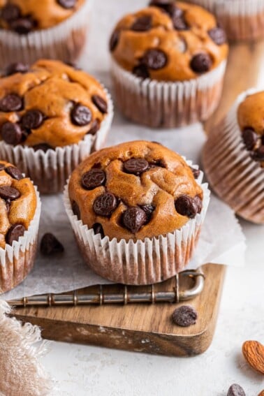 Protein muffins in paper wrappers on a wire rack.