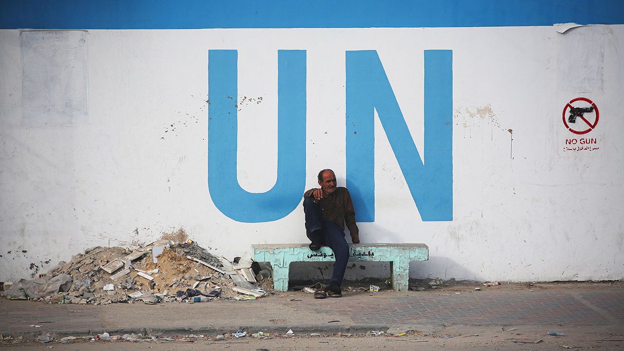 A man sits outside a United Nations-run school in Khan Younis, Gaza