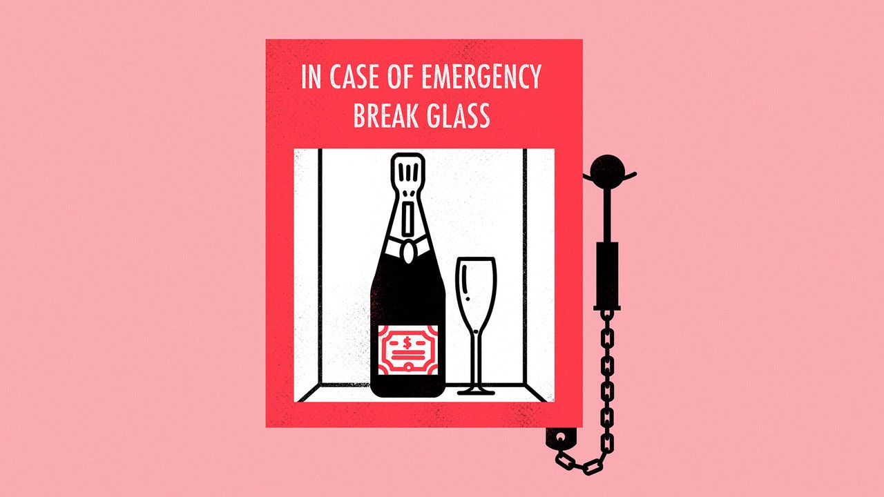 A bottle of Champagne and a glass inside of a “Break glass in case of emergency” box.