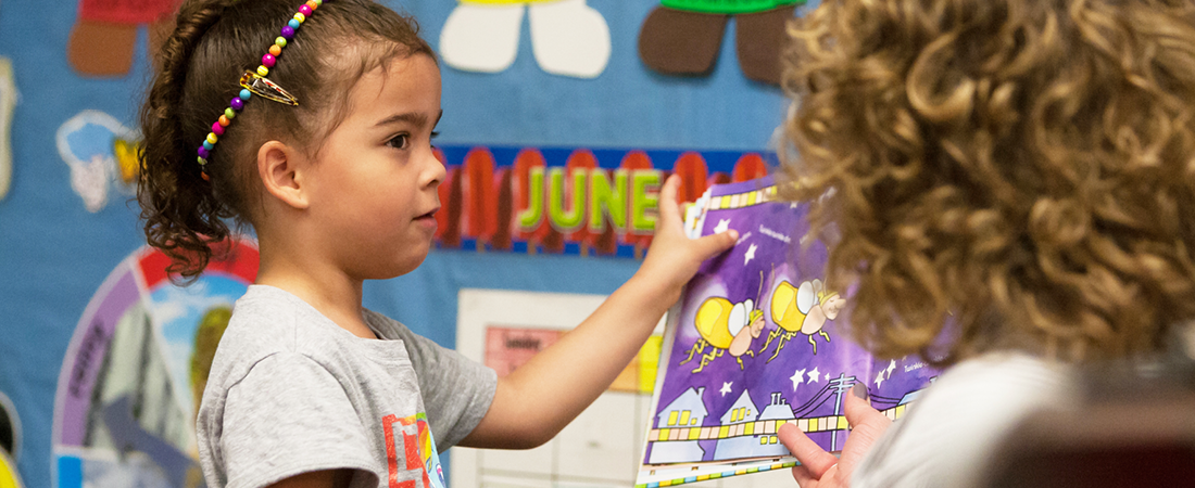 A photo of student and teacher representing Emergent Multilingual Learners