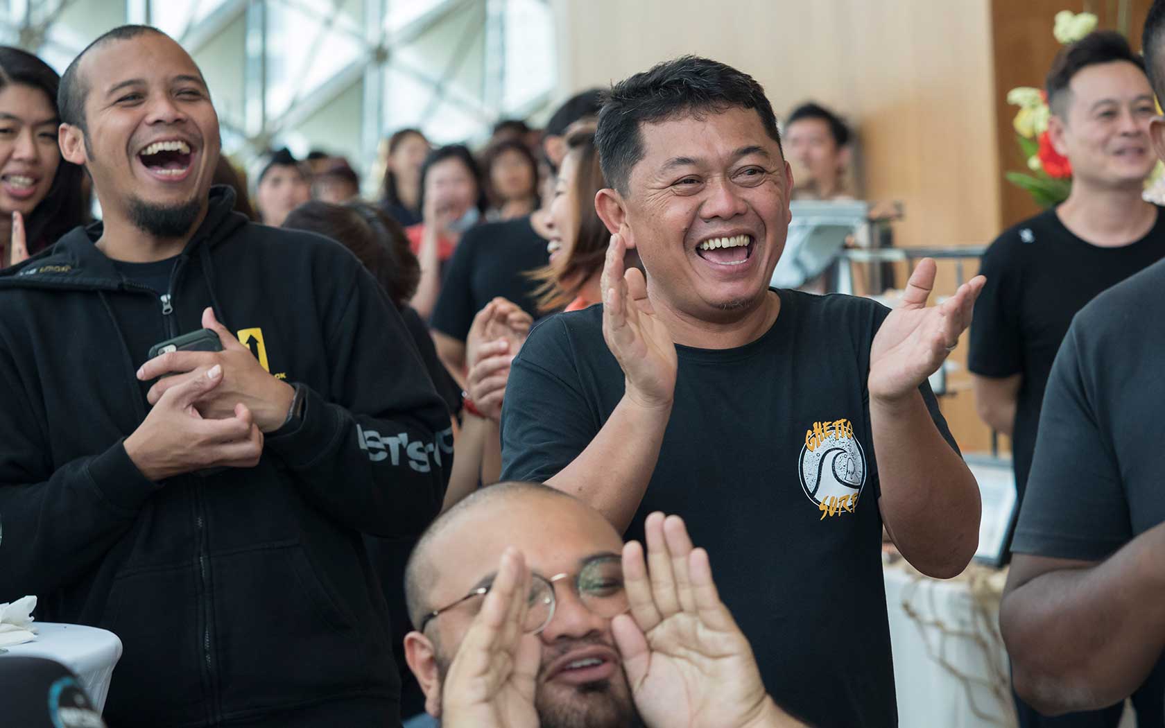 Image of Esplanade staff laughing.