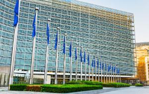 Facade of Berlaymont building with row of European flags