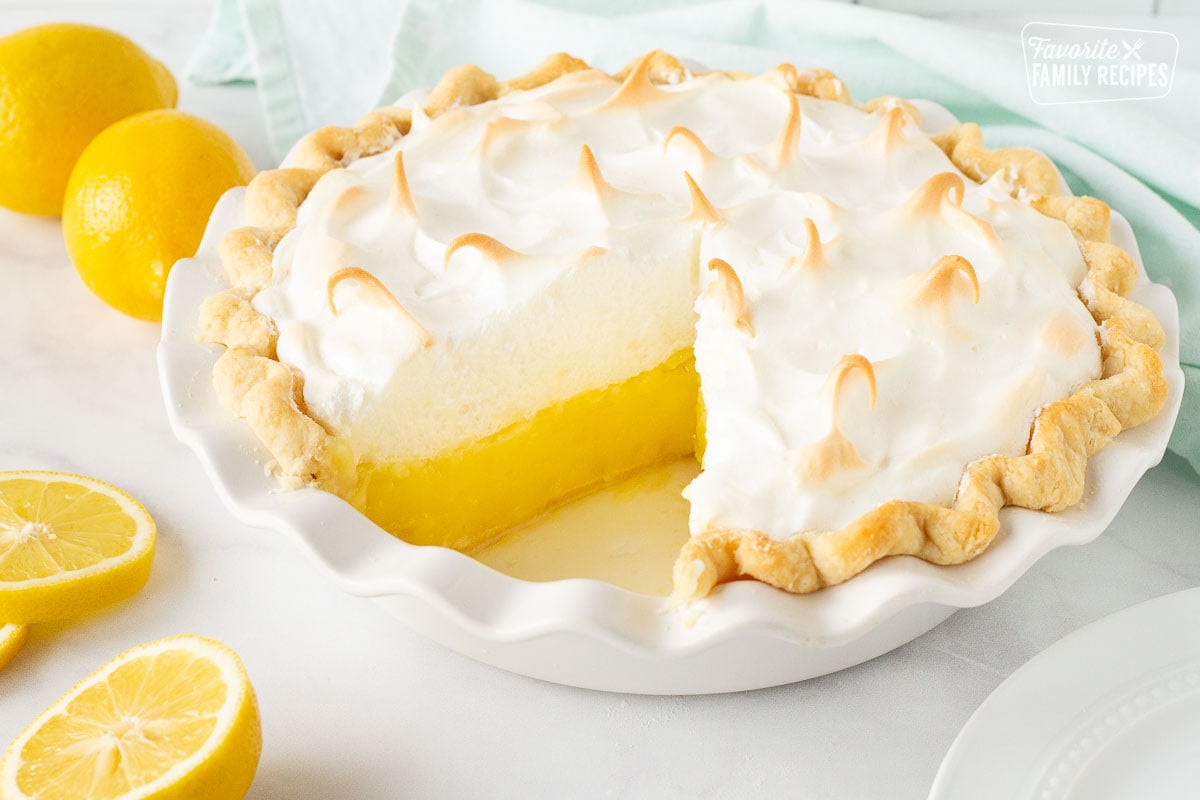 Lemon Meringue Pie with a cut out slice.