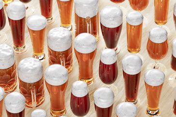 many light lagers in beer glasses with foam