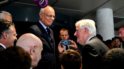 Edouard Philippe et Michel Barnier, à Reims, le 11 septembre 2024. (FRANCOIS NASCIMBENI / AFP)