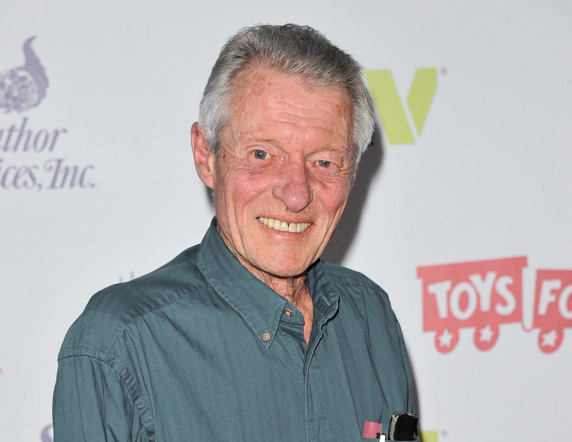 This Dec. 1, 2013 file photo shows Ken Osmond at the 82nd Annual Hollywood Christmas Parade in Los Angeles.  Osmond, who played the two-faced teenage scoundrel Eddie Haskell on TV’s “Leave it to Beaver,” has died. Osmond's family says he died Monday, May 18, 2020, in Los Angeles. He was 76. 