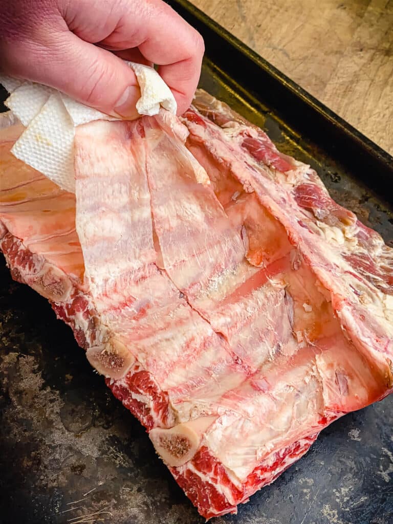 membrane being peeled off beef ribs