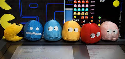 A photograph of stuffed toy PAC-MAN characters 