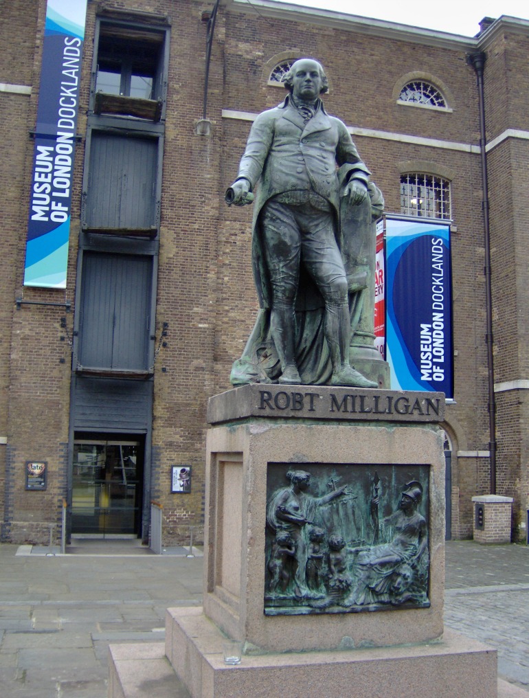 Statue of the English merchant Robert Milligan (1746-1809) in front of the Museum of London Docklands. Photo Credit: © By Tubantia via Wikimedia Commons.