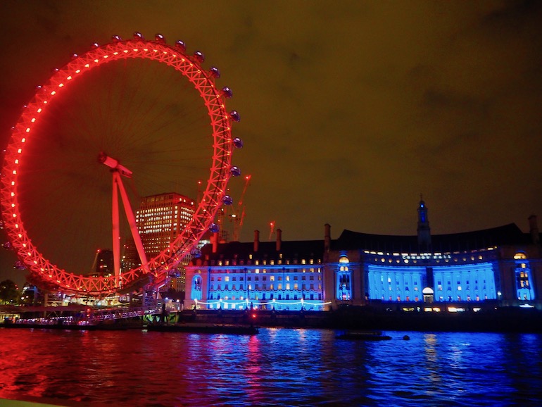 London Eye and County Hall illuminated at night. Photo Credit: © Ursula Petula Barzey.