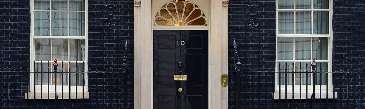 Entrance to 10 Downing Street, home of UK Prime Ministers. Photo Credit: © Sergeant Tom Robinson RLC via Wikimedia Commons.