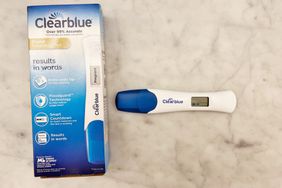 The Clearblue Digital Pregnancy Test with Smart Countdown on a counter next to its box