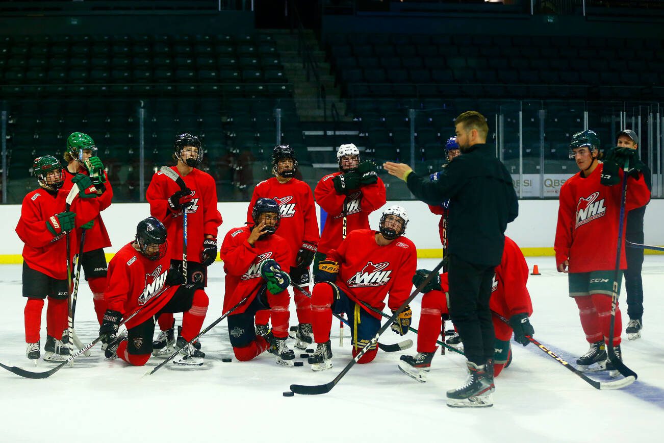 Silvertips players gather to listen to their coaches during the first day of training camp on Thursday, August 31, 2023, at Angel of the Winds Arena in Everett, Washington. (Ryan Berry / The Herald)