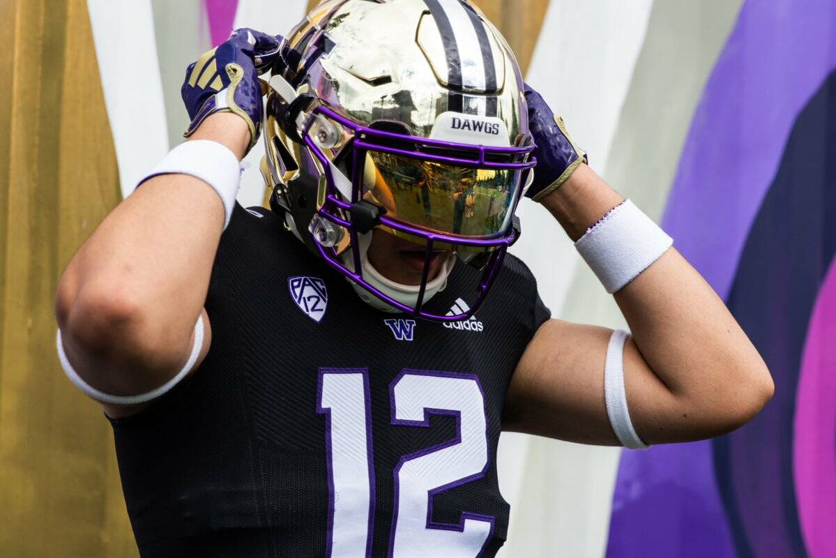 Kamiak High School’s Victor Sanchez Hernandez Jr. puts on a University of Washington football helmet. Sanchez Hernandez, a three-star defensive end who’s heading into his senior season, committed to the Huskies. (Photo courtesy of Victory Sanchez Hernandez Jr.)