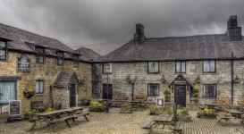 The exterior and courtyard of the Jamaica Inn pub in Cornwall.