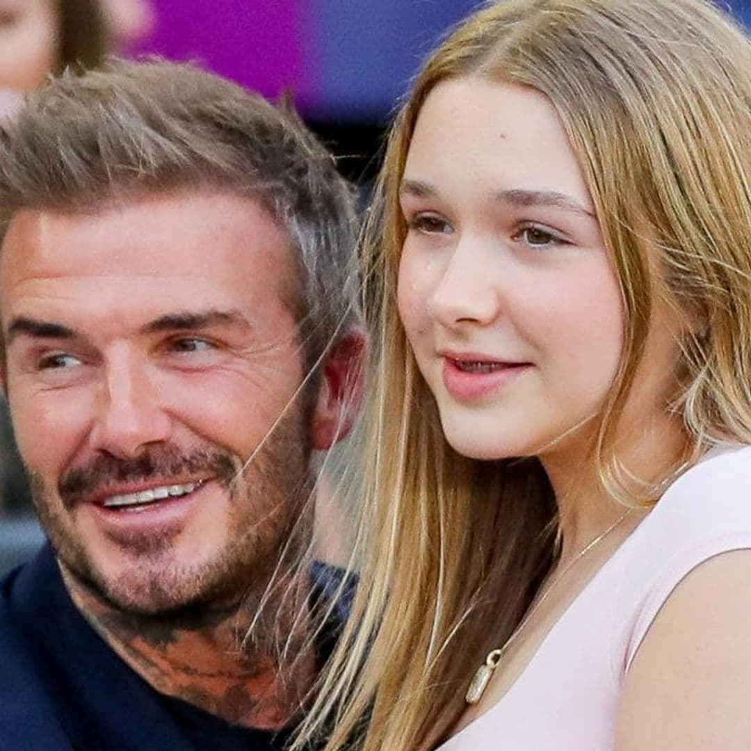 David Beckham and his daughter Harper hug as they watch Inter Miami match