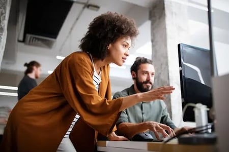 marketer explaining topic clusters to colleague