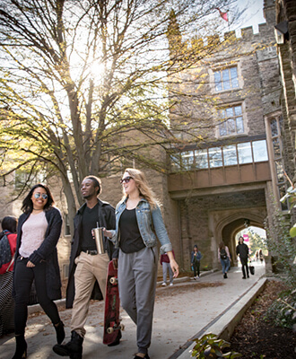 Undergraduate students walking at McMaster Campus