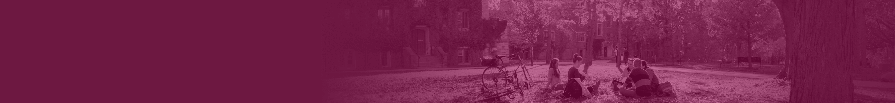 McMaster students sitting in a circle on campus lawn