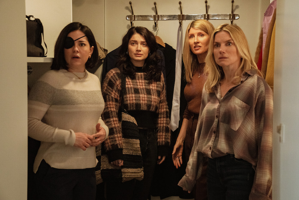 Four women standing shocked in a closet; still from 'Bad Sisters'