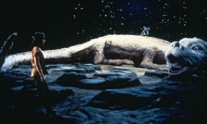 THE NEVERENDING STORY, from left: Noah Hathaway, Falkor (voice: Alan Oppenheimer), 1984. ©Warner Bros. / Courtesy Everett Collection