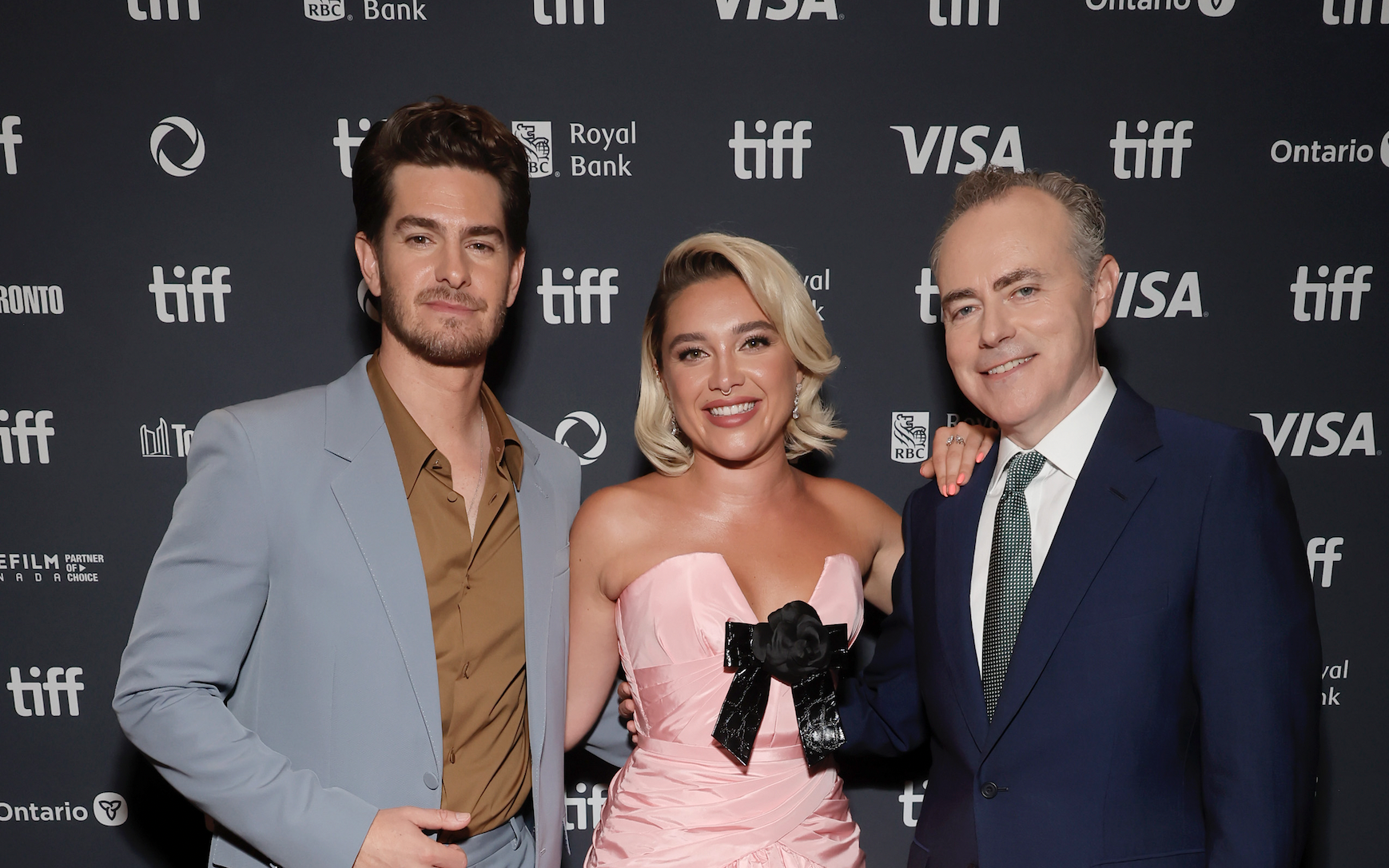 TORONTO, ONTARIO - SEPTEMBER 06: (L-R) Andrew Garfield, Florence Pugh, and John Crowley attend the premiere of 'We Live in Time' during the 2024 Toronto International Film Festival at Princess of Wales Theatre on September 06, 2024 in Toronto, Ontario.  (Photo by Emma McIntyre/Getty Images)