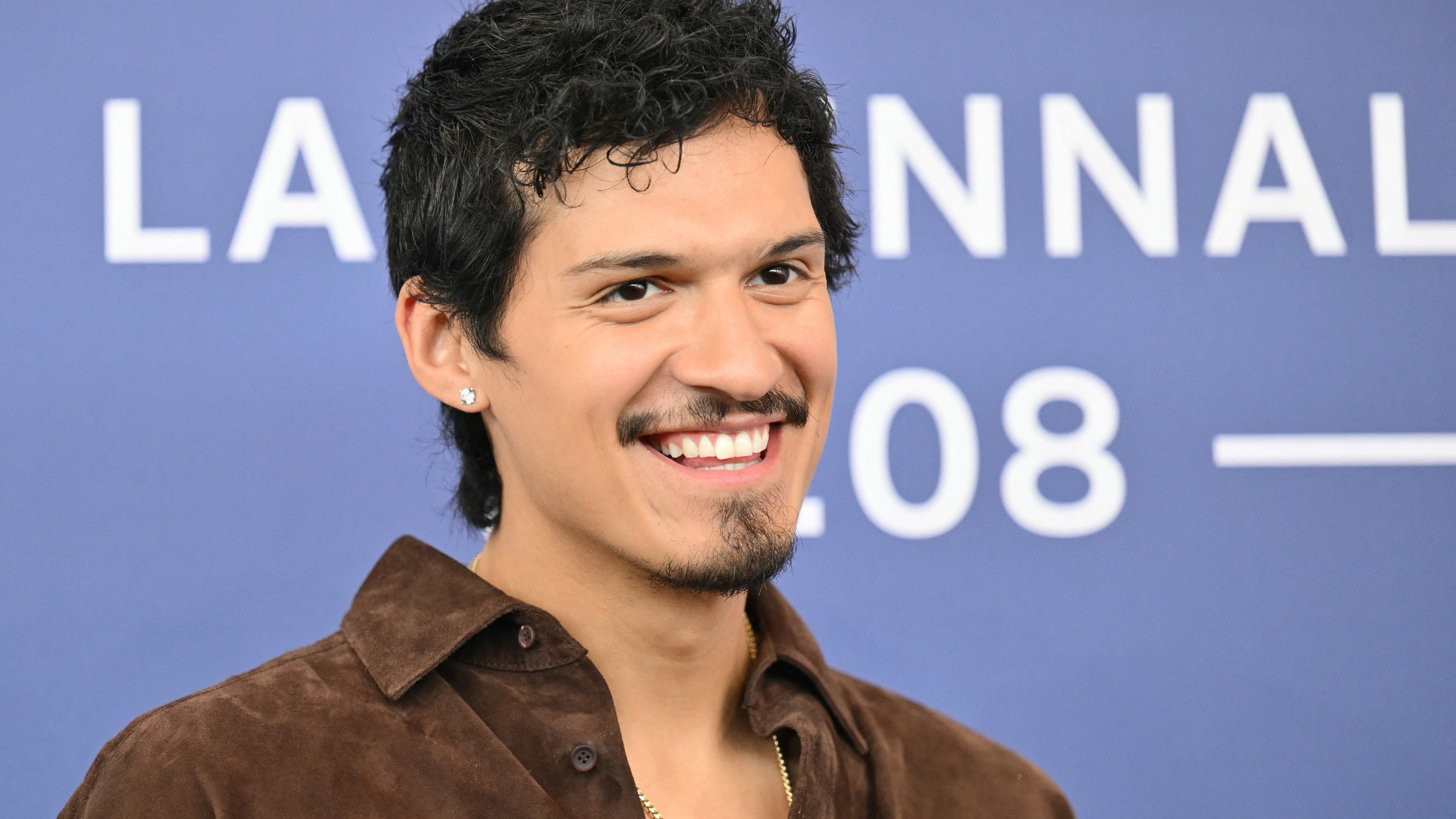 Actor Omar Apollo attends the photocall of the movie 'Queer' presented in competition during the 81st International Venice Film Festival at Venice Lido, on September 3, 2024. (Photo by Alberto PIZZOLI / AFP) (Photo by ALBERTO PIZZOLI/AFP via Getty Images)