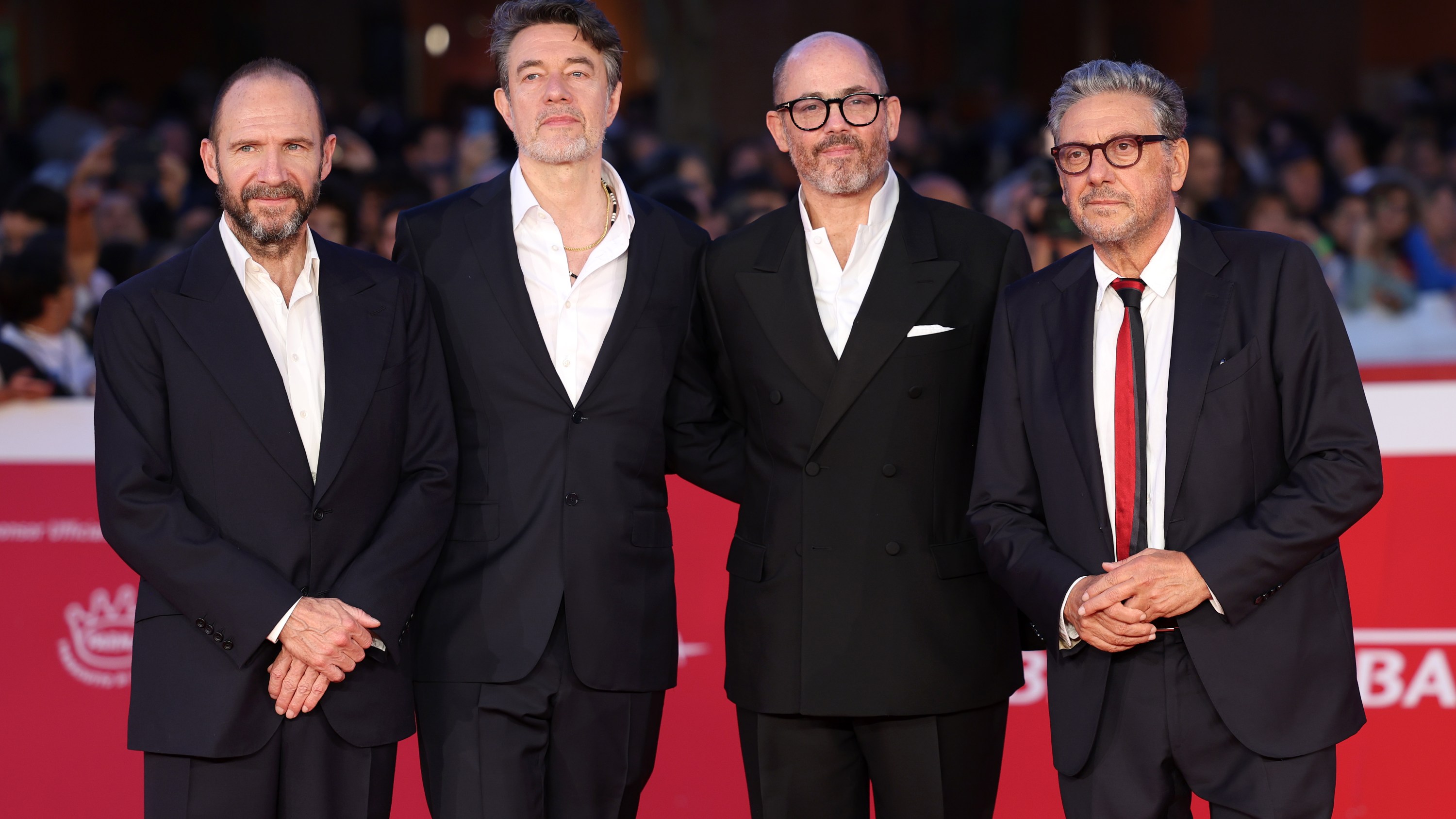 ROME, ITALY - OCTOBER 26: Ralph Fiennes, Peter Straughan, Edward Berger and Sergio Castellitto attend the 'Conclave' red carpet during the 19th Rome Film Festival at Auditorium Parco Della Musica on October 26, 2024 in Rome, Italy. (Photo by Vittorio Zunino Celotto/Getty Images)