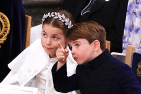 Prince Louis pointing next to Princess Charlotte