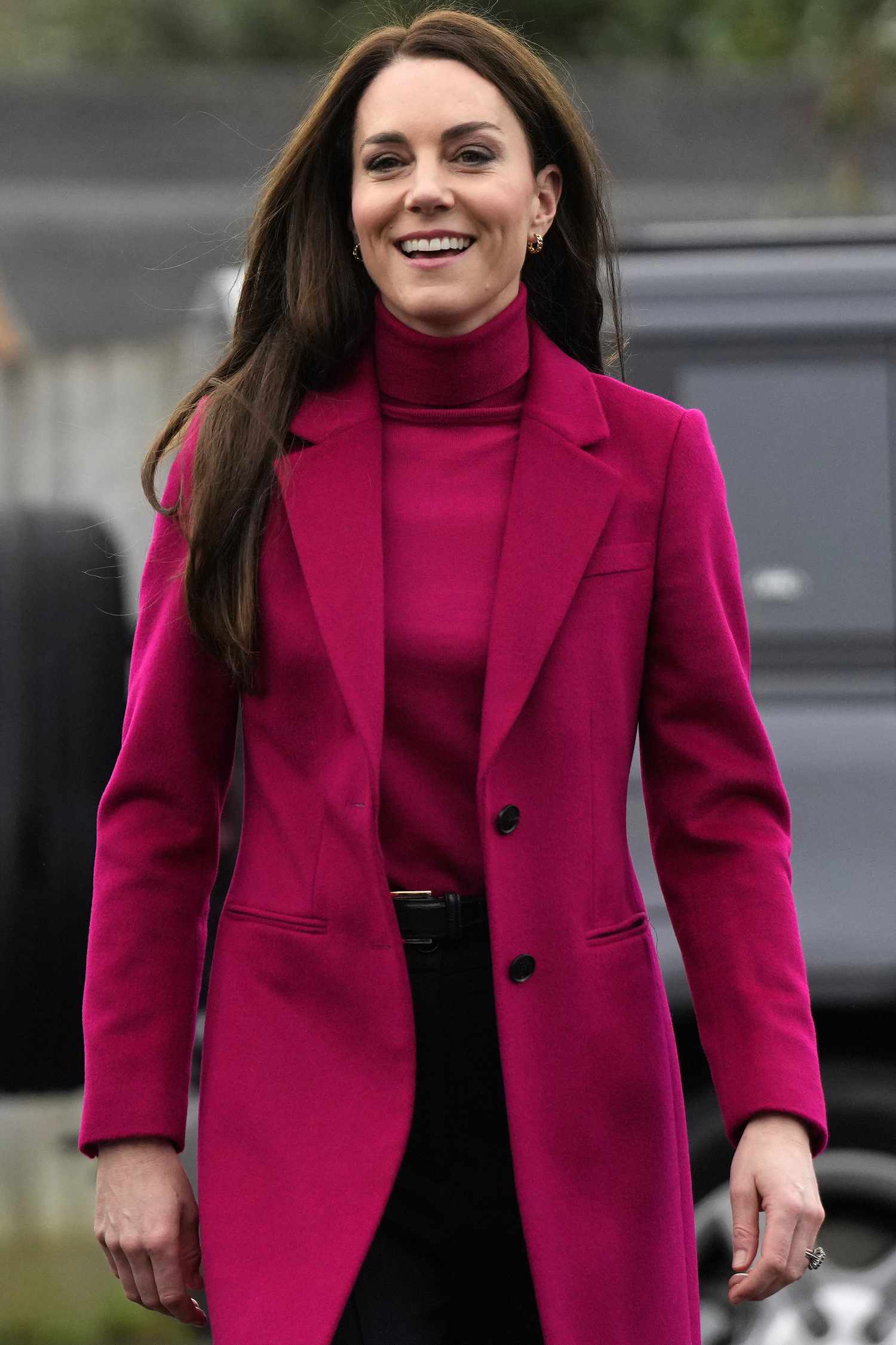 Kate Middleton in a bright pink turtleneck and overcoat