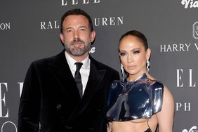 Ben Affleck Jennifer Lopez Wearing Cropped Metal Body Armor Straight Faces Arms Around Each Other at ELLE's Women In Hollywood Celebration December 5, 2023